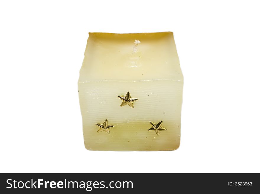 Gold christmas candle with stars isolated on white