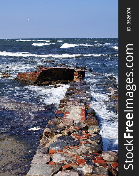 Brick wall on the sea coast of Baltyc sea, Russia. Brick wall on the sea coast of Baltyc sea, Russia
