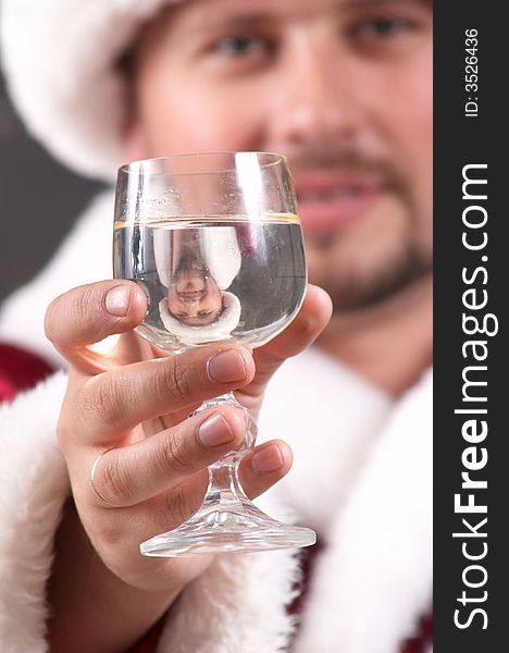 An image of Santa Claus drinking champagne. An image of Santa Claus drinking champagne
