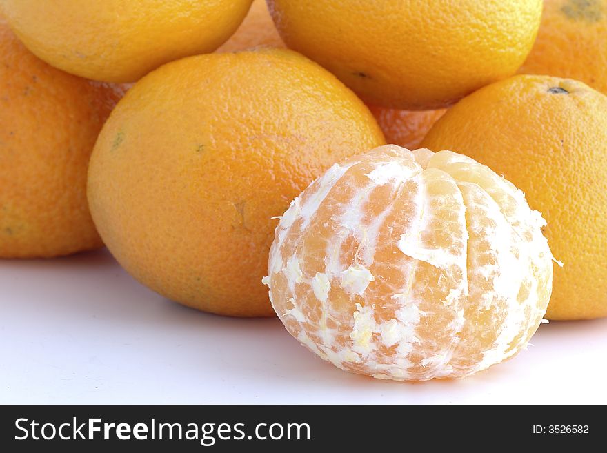 Tangerine peeled in background white