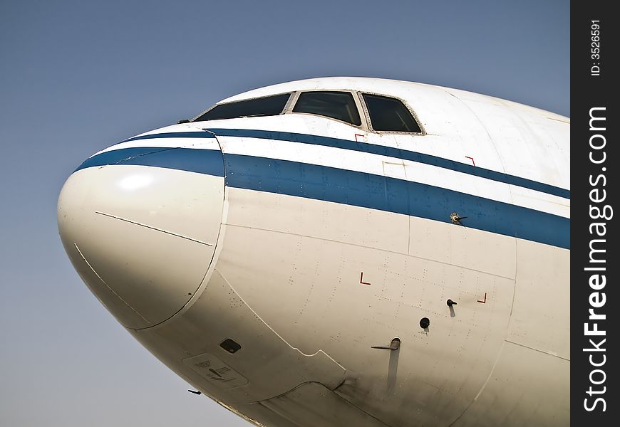 Front of an chinese aircraft waiting at the airport