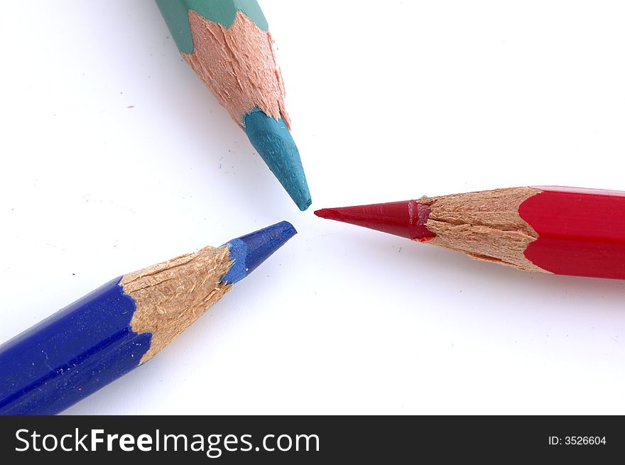 Three pencils of colors in background white. Three pencils of colors in background white