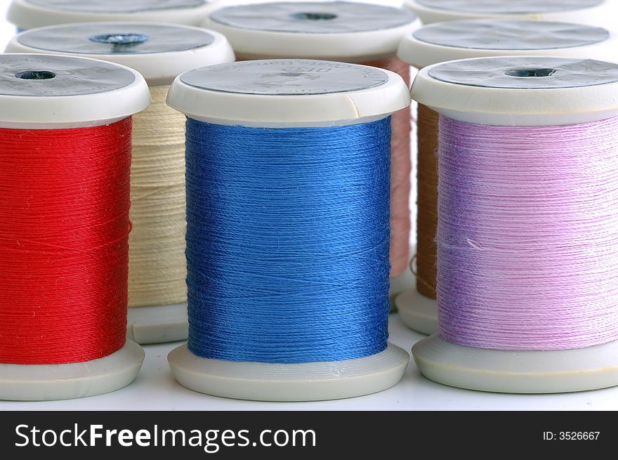 Bobbins of thread of colors