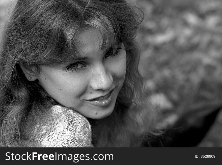 Nice curly girl smiling in the sunlight