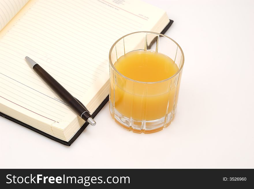 Orange juice and a diary
