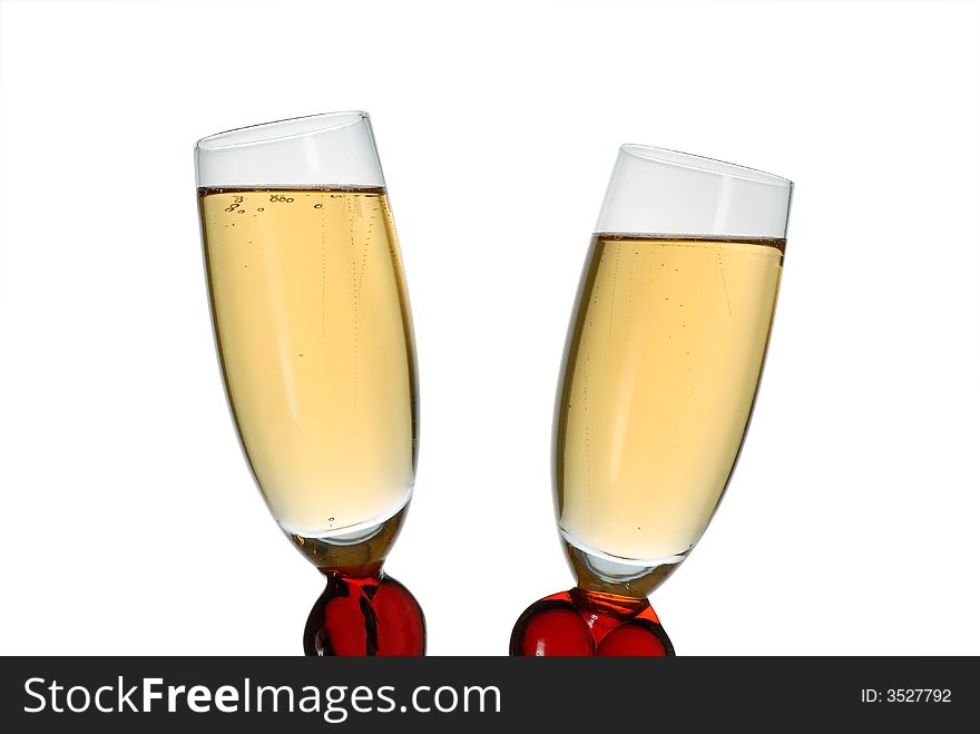 Pair of original wine glasses with champagne isolated on white background. Pair of original wine glasses with champagne isolated on white background