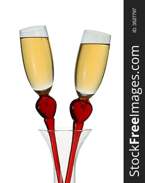 Pair of original wine glasses with champagne isolated on white background. Pair of original wine glasses with champagne isolated on white background