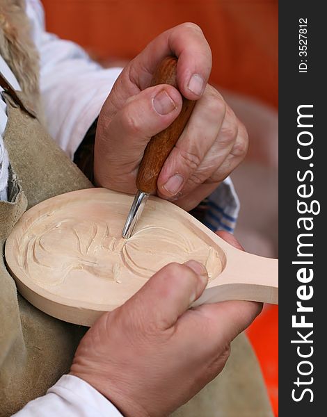 WoodcutterÂ´s hands working with chisel. WoodcutterÂ´s hands working with chisel