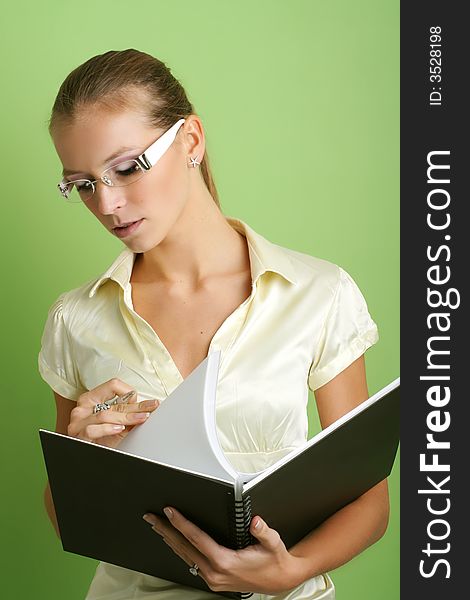 Business portrait of a young and successful woman with a folder. Business portrait of a young and successful woman with a folder