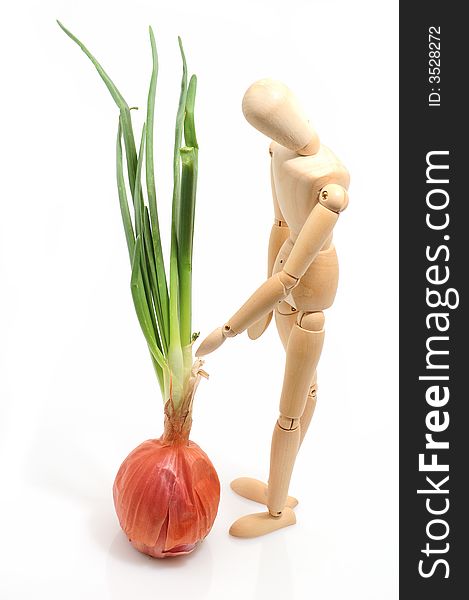Onion and a wooden figure. Onion and a wooden figure