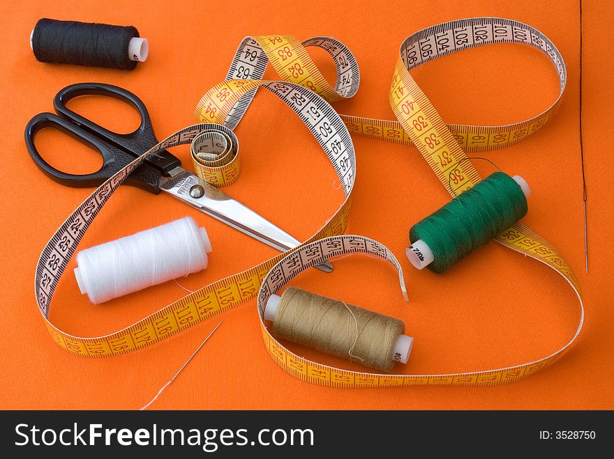 Sewing set on an orange background