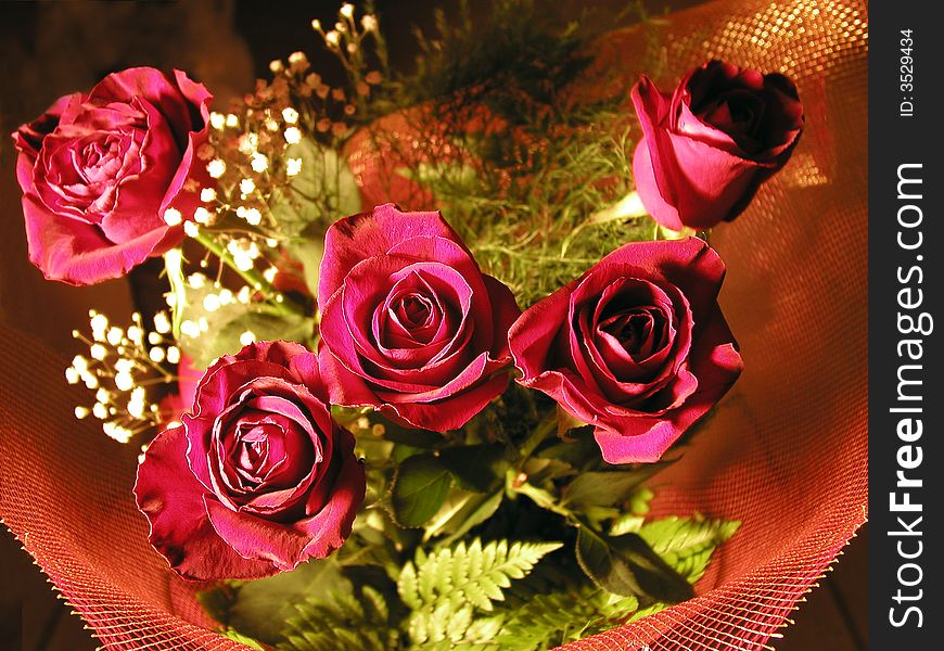 Close up of holiday bouquet of red roses.