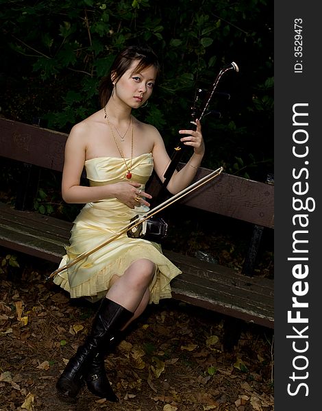 A girl starting playing Erhu. A girl starting playing Erhu