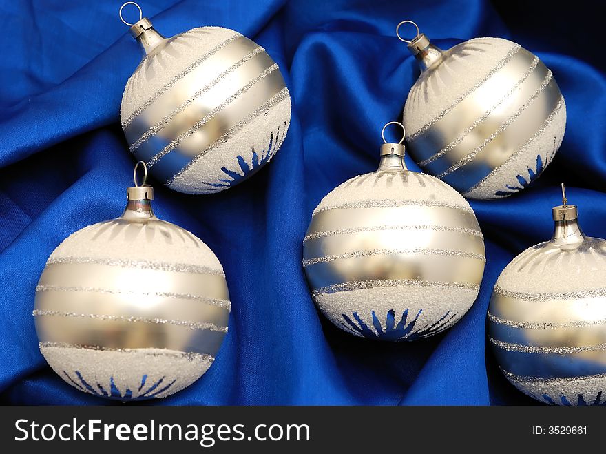 Christmas balls decorations on blue stuff. Christmas balls decorations on blue stuff