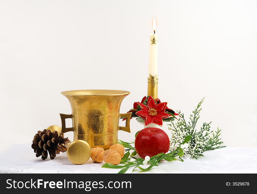 Gold candle and christmas decorations