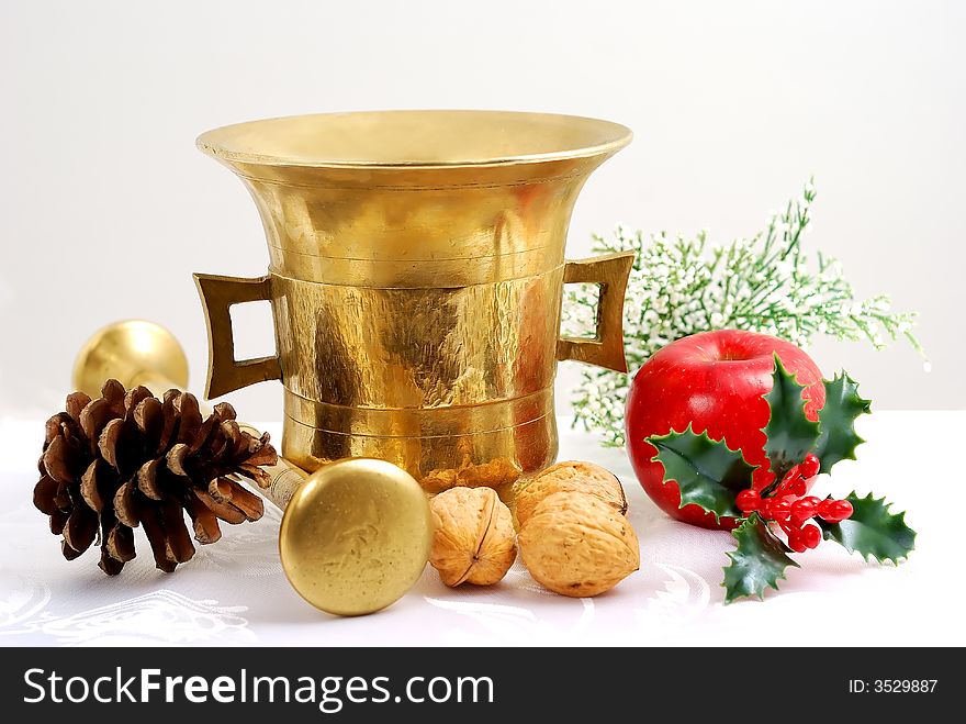 Gold mortar and christmas decorations