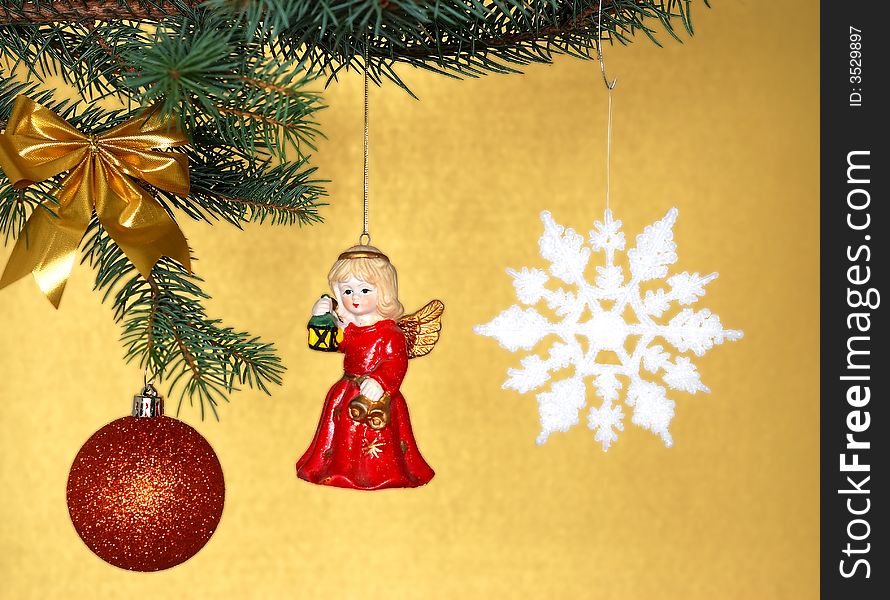 Christmas decorations opposite golden background