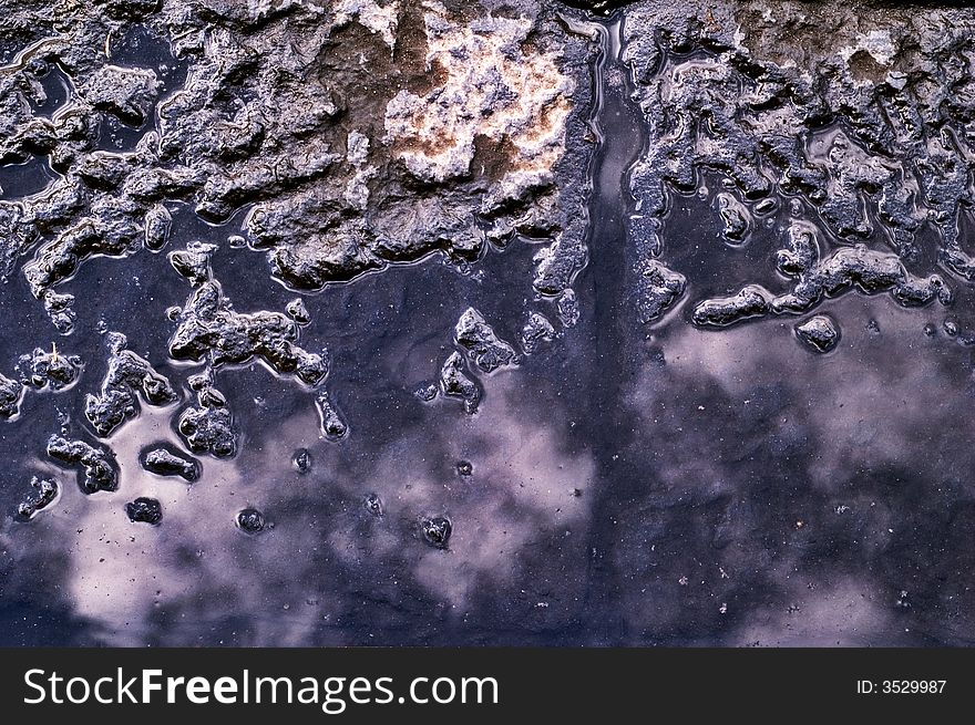 Sky reflecting in pool with asphalt. Sky reflecting in pool with asphalt