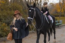 Happy Family With Black Horse Stock Photography Happy Family With Black Horse Stock Photography
