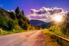 Mountain Road Near The Coniferous Forest With Cloudy Morning Sky Stock Photos Mountain Road Near The Coniferous Forest With Cloudy Morning Sky Stock Photos
