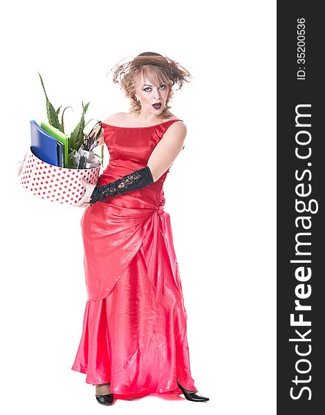 Fired actress in a red dress with a box of things express her emotions on a white background. Fired actress in a red dress with a box of things express her emotions on a white background