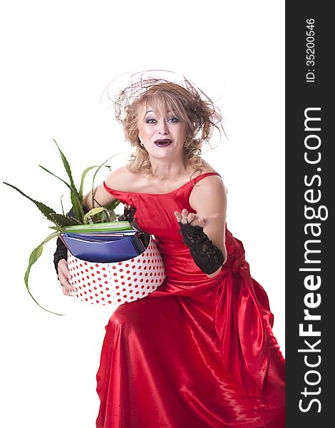 Fired actress in a red dress with a box of things express her emotions on a white background. Fired actress in a red dress with a box of things express her emotions on a white background