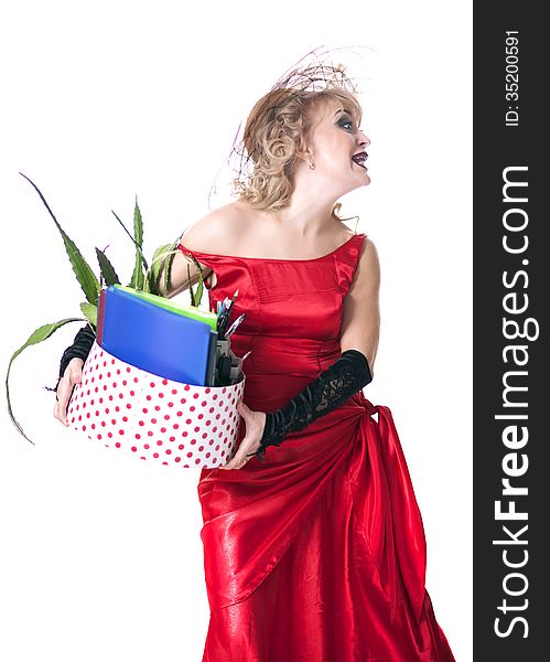 Fired actress in a red dress with a box of things express her emotions on a white background. Fired actress in a red dress with a box of things express her emotions on a white background