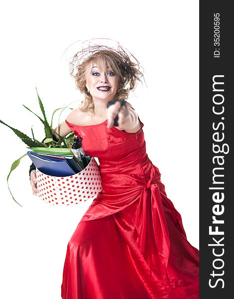 Fired actress in a red dress with a box of things express her emotions on a white background. Fired actress in a red dress with a box of things express her emotions on a white background