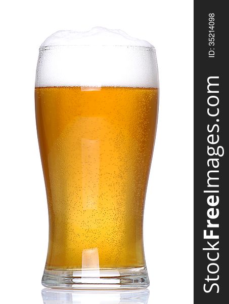 Glass of lager with a white background and white floor support. Glass of lager with a white background and white floor support