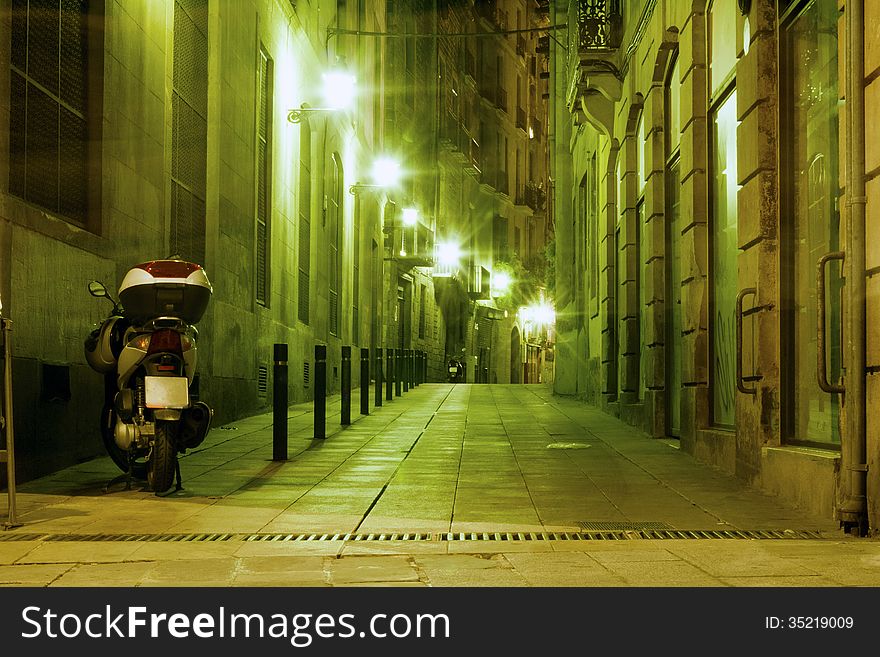 Illuminated Barcelona night street in famous Gothic Quarter district