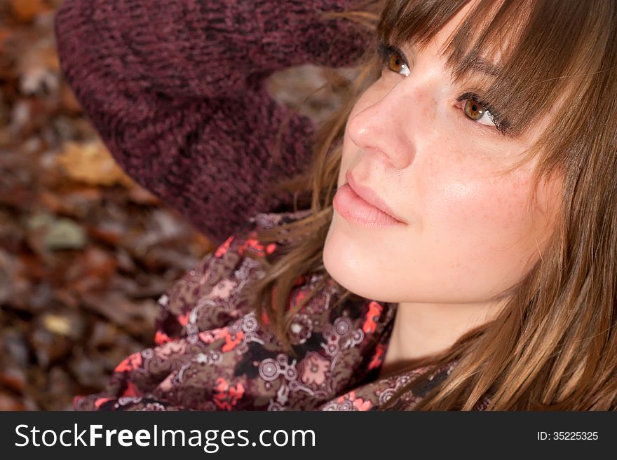 Beauty Girl Face In The Autumn