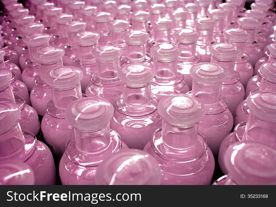 Perspective texture of plastic bottles of pink liquid soap. Perspective texture of plastic bottles of pink liquid soap