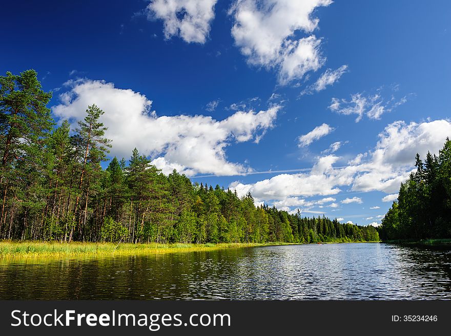 Beautiful river coast in the wild Karelian (Karjala) woods. Beautiful river coast in the wild Karelian (Karjala) woods