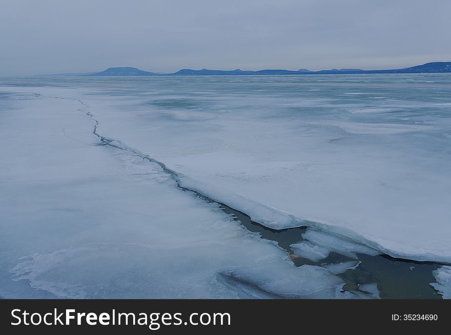 Frozen lake with mountains. Frozen lake with mountains.