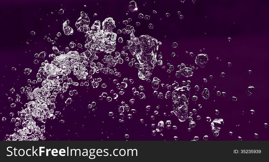 Sparkling Mercury Rain Close shot of a falling drops of water.