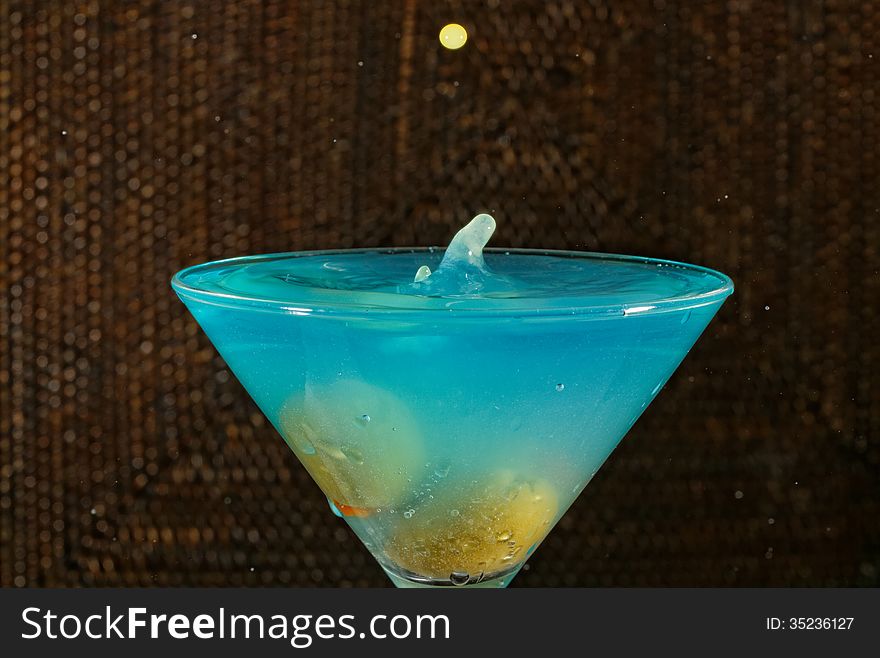 Blue Martini drink with green olives