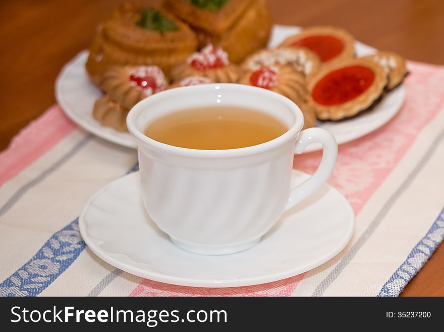 On a table there is a tea prepared for a breakfast. On a table there is a tea prepared for a breakfast