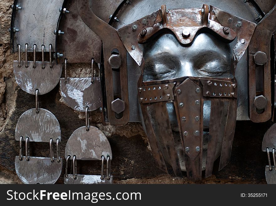 Hand-hammered iron mask.