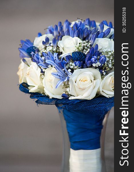 Wedding Bouquet made of white roses and blue agapantus.