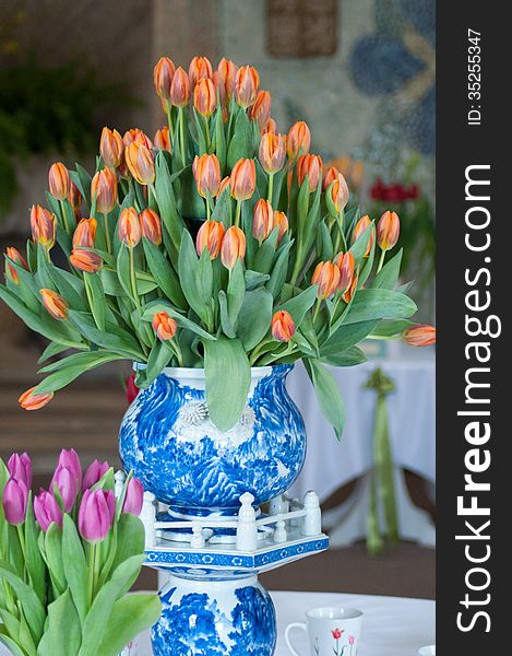 Big ceramic Vase of orange tulips. Big ceramic Vase of orange tulips.