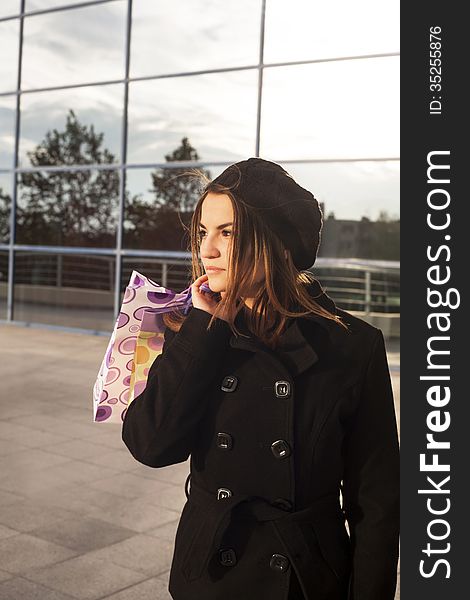 young woman with shopping bags