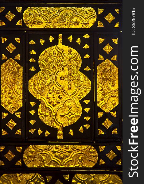 Moroccan pattern of golden glass and metal from Moroccan lamp. Moroccan pattern of golden glass and metal from Moroccan lamp.