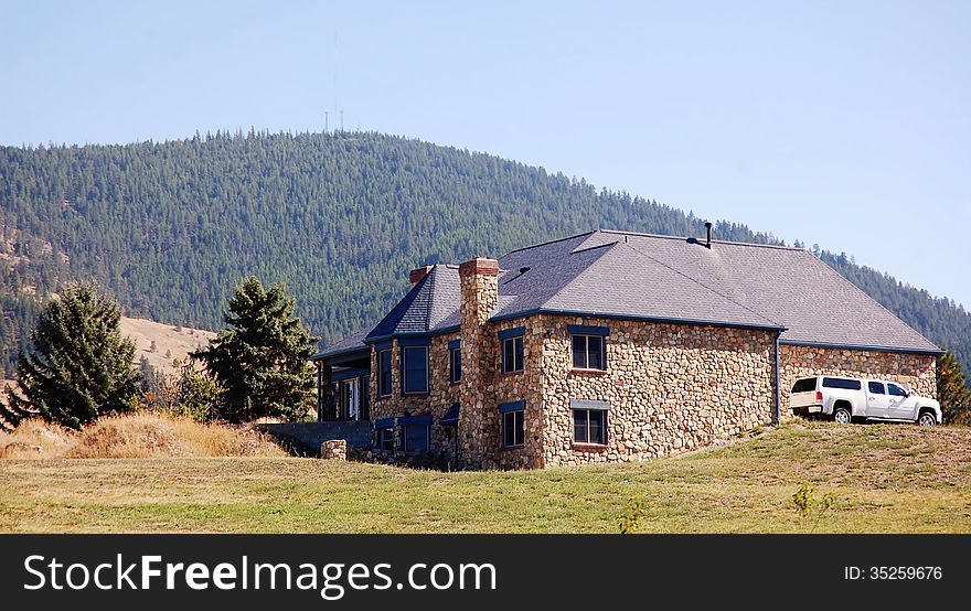 Stony home in Montana nearby mountain looking very impressive