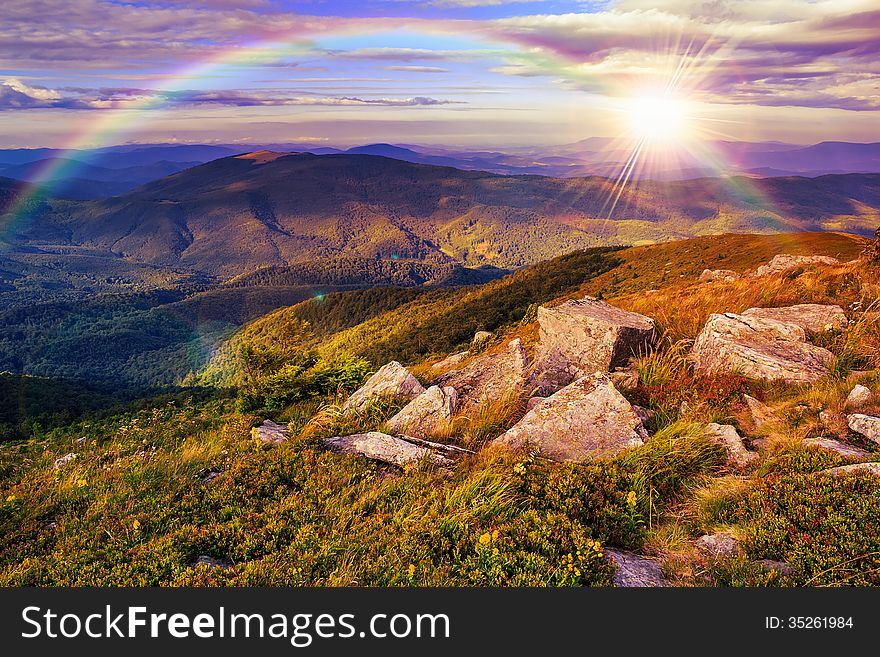 Mountain landscape. valley with stones on the hillside. forest on the mountain under the beam of light falls on a clearing at the top of the hill. Mountain landscape. valley with stones on the hillside. forest on the mountain under the beam of light falls on a clearing at the top of the hill.