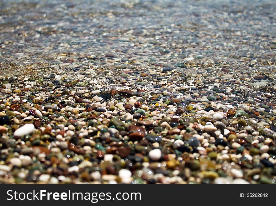 Waves Lapping On Pebble Beach