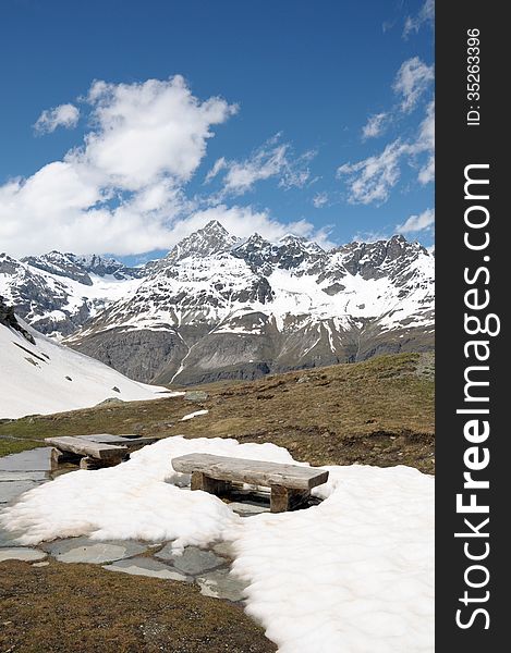 Bench in snow on path above Schwarzsee in Swiss Alps. Bench in snow on path above Schwarzsee in Swiss Alps