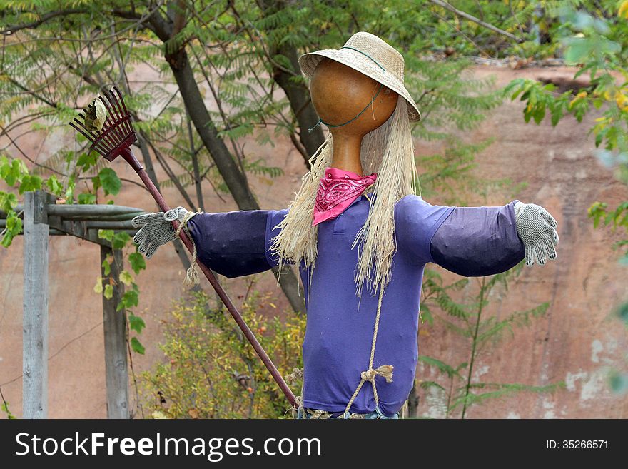 Home Made Garden Scare Crow With Straw Hat. Home Made Garden Scare Crow With Straw Hat