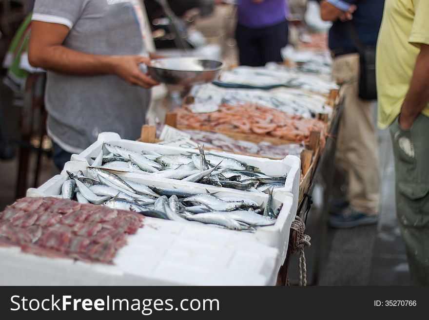 A man selling fresh fish in the fish market