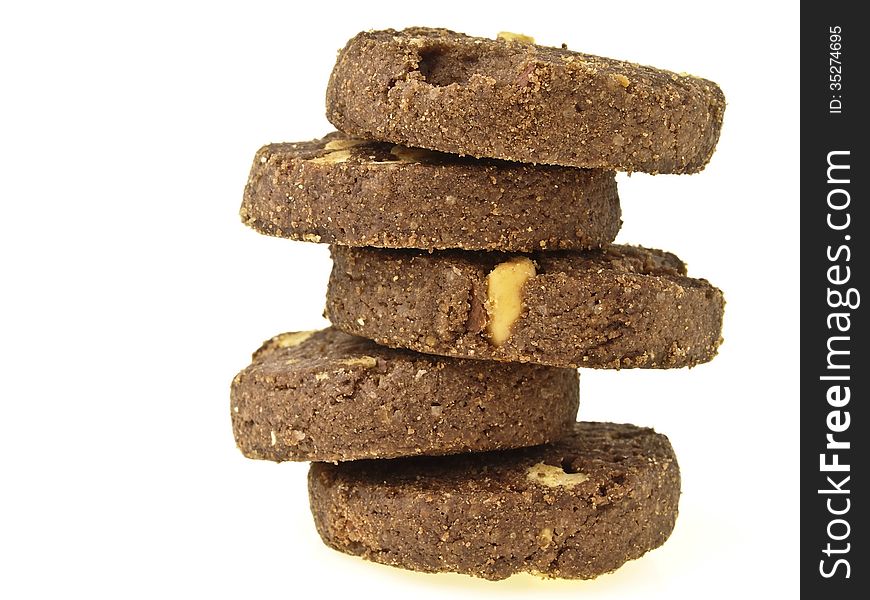 Zigzag stack of five peanut vegetarian cookies on white background. Zigzag stack of five peanut vegetarian cookies on white background