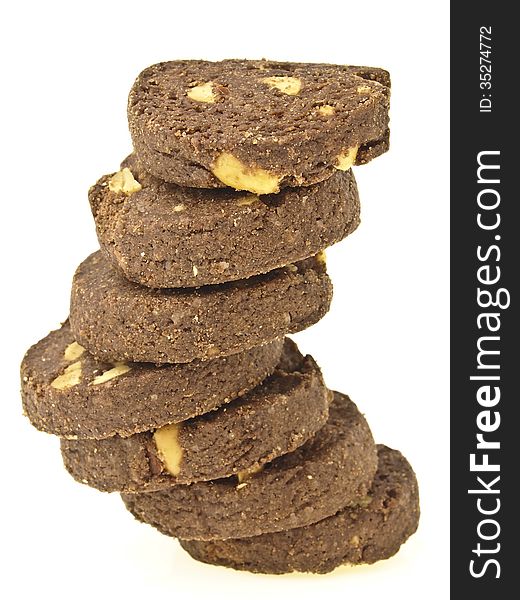 Tower stack of peanut vegetarian cookies in stairs shape on white background. Tower stack of peanut vegetarian cookies in stairs shape on white background